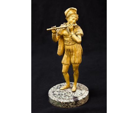 A 19TH CENTURY GILT BRONZE SCULPTURE OF A FLUTE PLAYER, the male flute player in medieval dress with pantaloons, cape and fea