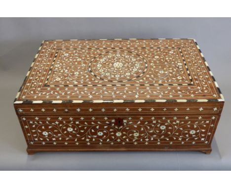 AN INDIAN INLAID SANDALWOOD BOX.&nbsp;The rectangular lid inlaid with ebony and ivory or bone in radiating scrolling patterns