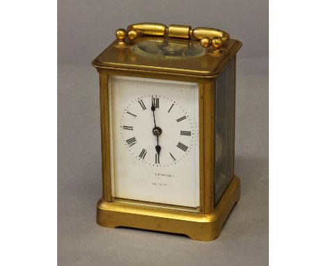 A GILT BRASS CASED CARRIAGE CLOCK, with a white enamelled dial indistinctly signed 'Thompson London' with a two train movemen