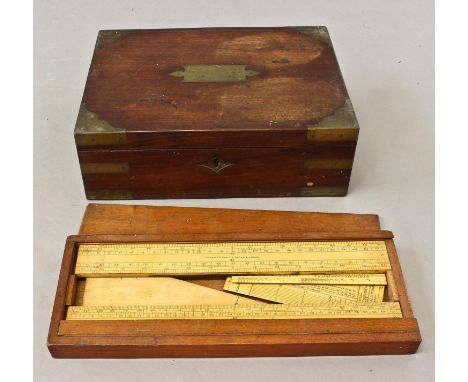 A REGENCY BRASS BOUND FITTED BOX, the campaign style box with a rectangular top with flush fitting brass handle and corners, 