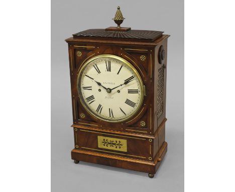 A REGENCY MAHOGANY AND BRASS INLAID BRACKET CLOCK BY TRAPNELL OF BRISTOL, the crircular convex dial with Roman numerals, sign