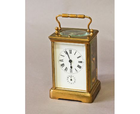 A BRASS CASED CARRIAGE CLOCK WITH ALARM, with a rectangular white enamelled dial with Roman numerals and subsidiary alarm dia