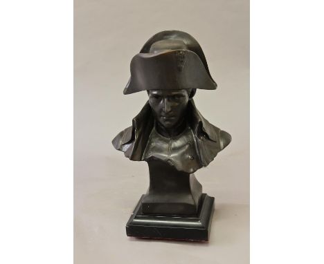 A BRONZE BUST OF NAPOLEON, head and shoulders, wearing his hat and with open collar, on a tapering square section base, marke