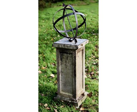 A CELESTIAL GLOBE ON PLINTH BASE, the globe with arrow pointer on a square base with engraved text, N S E W symbols and flora