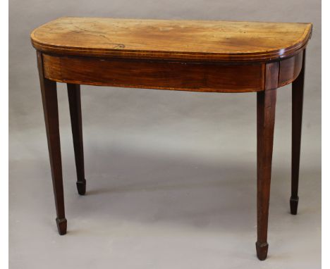 A GEORGE III MAHOGANY FOLD TOP CARD TABLE, the 'D' shaped top with satinwood stringing enclosing a baize lined playing surfac