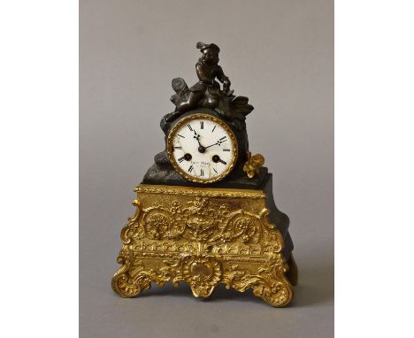 A FRENCH BRONZE AND ORMOLU MANTLE CLOCK BY H. MARC OF PARIS, the white enamelled dial signed H. Marc, Paris, with Roman numer