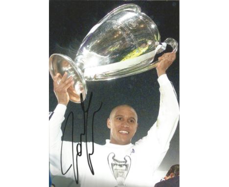 Roberto Carlos Real Madrid Signed 12 x 8 inch football photo. Good Condition. All autographs are genuine hand signed and come