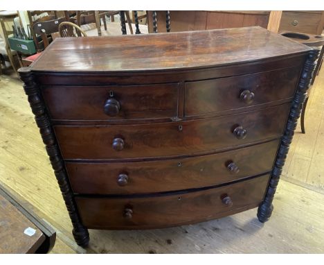 A 19th century mahogany bow front chest, having two short and three long drawers, 112 cm wide, and a trunk, 83 cm wide (2) 