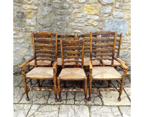 A set of eight Titchmarsh & Goodwin style oak ladder back dining chairs, with reeded seats (6+2)The chairs are not marked, bu