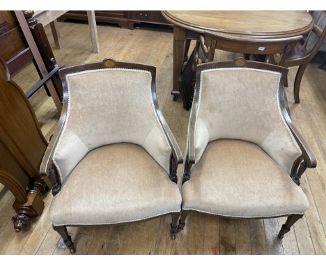 A pair of mahogany tub chairs, a mahogany drop leaf table, 92 cm wide, and a trunk (4) 