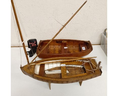 A wooden model of a clinker built boat, 50 cm wide, and another, 50 cm wide (2) 