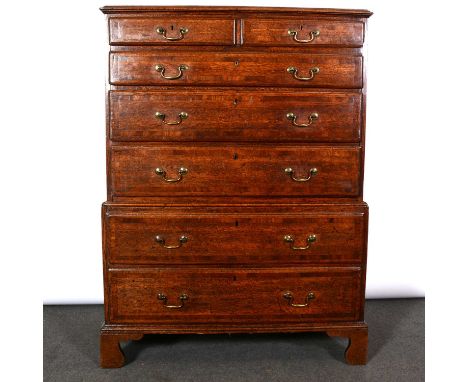George II oak and mahogany banded chest on chest, rectangular top with ogee moulded outlines top with two drawers, the upper 