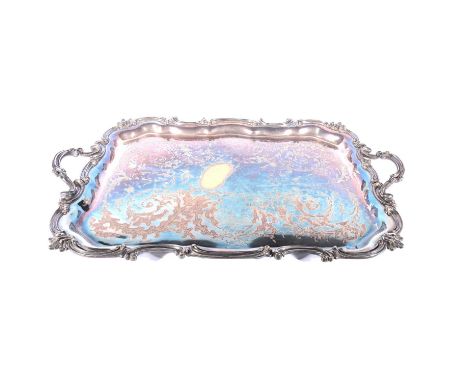 A large Victorian silver plated tray, rectangular form with scrolled borders, twin cast handles, engaved decoration, 88cm.