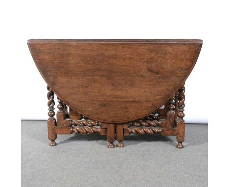 An oak gateleg dining table, the base late 17th century, replaced oval top, double gate barley twist uprights and rails, 123 