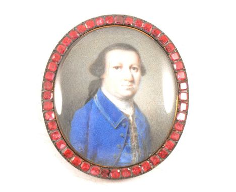 Nathaniel Hone, Gentleman in a blue coat, oval portrait miniature, garnet surround, 4 x 3.5cm overall.Ivory Act 2018 Registra