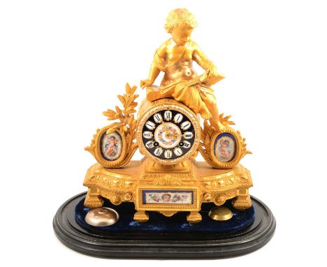 Late 19th Century French gilt metal mantel clock, the case mounted with a cherub reading, inset porcelain panels and dial, cy