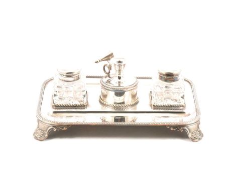 George III style silver plated desk stand, rectangular platform with rounded corners, gadrooned edge, four scrolled feet, fit