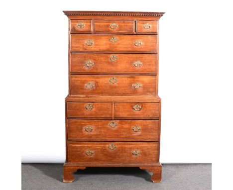 George III oak chest on chest, dentil and cavetto moulded cornice, the upper section with three short drawers above three lon