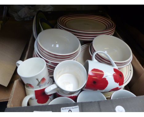 Box of modern ceramic cups, bowls and plates in poppy design