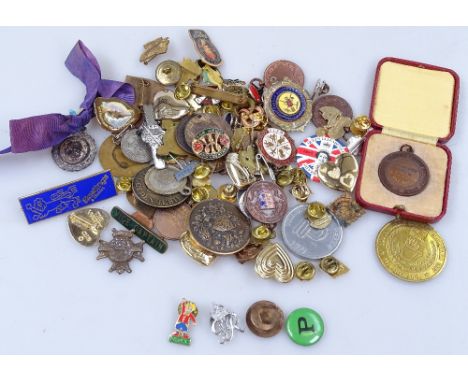 A boxful of enamel and other badges and medals 