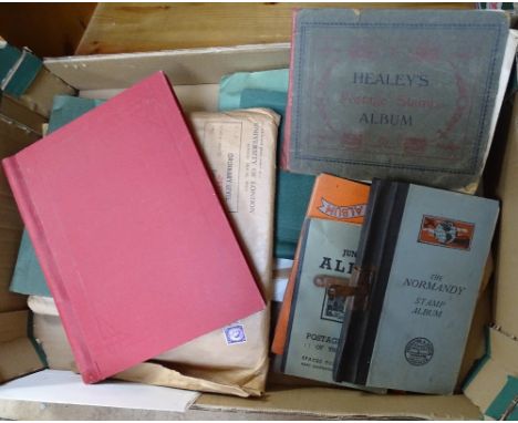 A box of postage stamp albums etc 