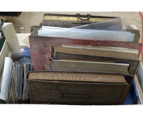 A group of Victorian and later photograph albums, Vintage postcards, linen etc 