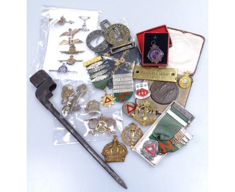 A collection of military items, including bayonet, enamel badges, Navy and RAF Wings badges and buttons etc 