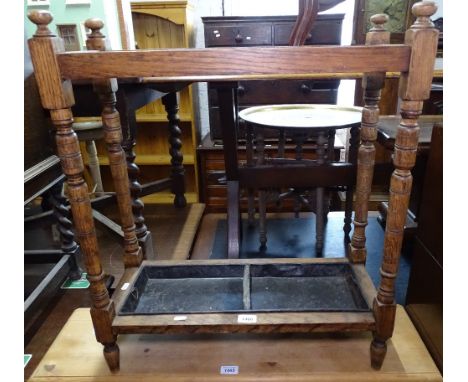 A 1920s oak stick stand, W61cm 