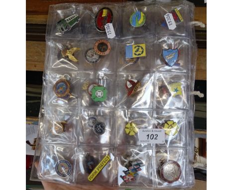 A collection of enamel lapel badges 