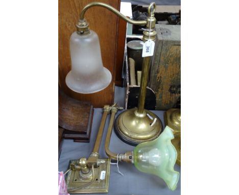 A Victorian brass student's desk lamp, with opaque glass shade, height 16", and an adjustable brass wall light fitting, with 