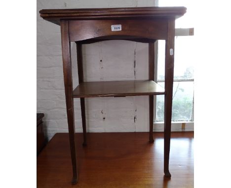 An Edwardian mahogany fold over card table, on square tapered legs, W50cm 