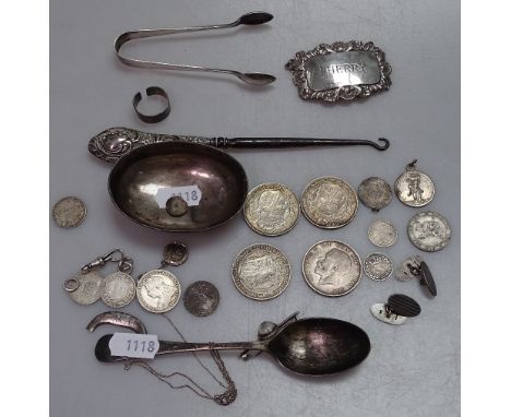 A box containing a silver-handled button hook, silver coins, a decanter label etc 