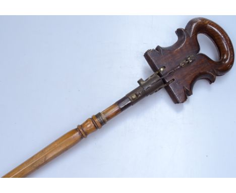 An unusual Victorian brass-mounted beech shooting stick 