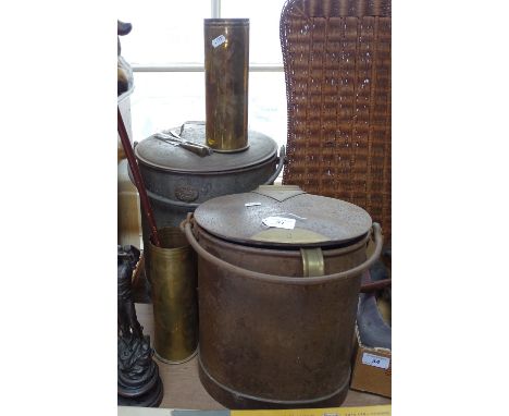 A brass-mounted metal feed canister and server, height 12", and a Lister metal pot, and 2 brass cannon shells, and a swagger 