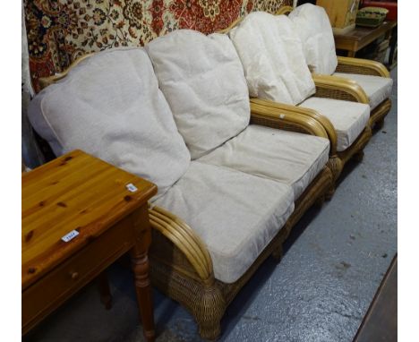 A good quality cane panelled conservatory suite, comprising of 2-seater sofa, a pair of matching armchairs, a footstool, and 