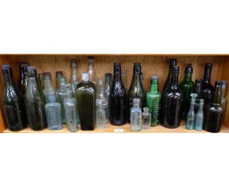 A shelf of various Vintage bottles 