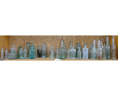 A shelf of aqua bottles 