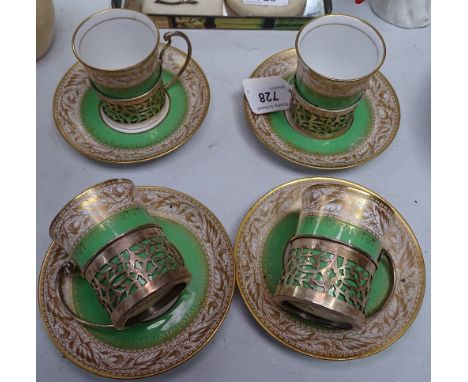 A set of 4 Spode Copelands china "Oaklea" coffee cans in pierced silver holders, and matching saucers 