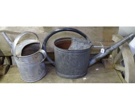 A Vintage Continental galvanised watering can, and another 
