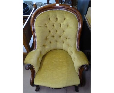 A Victorian mahogany-framed and button-back upholstered armchair 