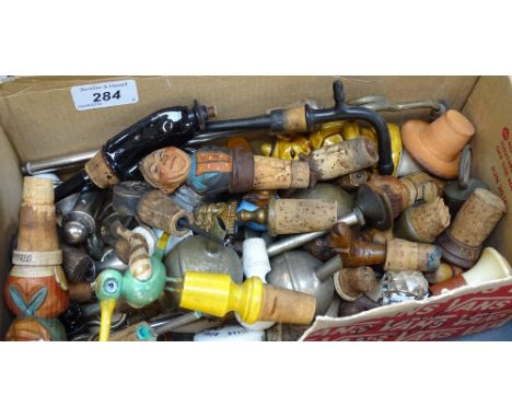 A box of Vintage and novelty bottle stoppers 