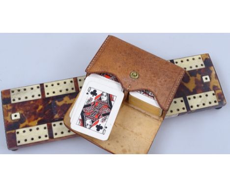 A tortoiseshell-mounted cribbage board, 7.75", and miniature playing cards 
