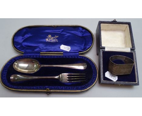 A silver fork and spoon in original presentation case, retailed by W Lister &amp; Sons Newcastle, and a boxed silver napkin r