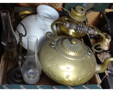 A large Victorian brass kettle, an oil lamp, a twin-branch candle holder etc 