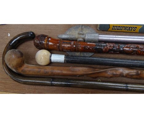 A walking stick with ivory handle, 3 other walking sticks, and a shooting stick (5) 