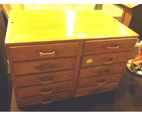 Set of oak collectors drawers with eight drawers and brass label plates 38 x 58 x 38
