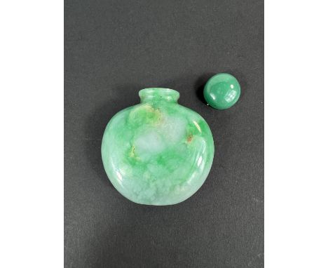 A Chinese spinach green jade coloured hard stone snuff bottle height 6cm