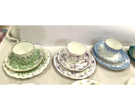 Four Wileman Foley trio sets:- 10038 (Rose Sprays); 9806 (Grass print); 9929 (Border violet print):- 7069 (Petunia).Condition