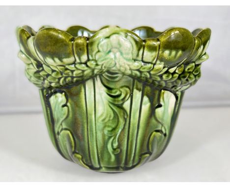 Ault Art Pottery: A pottery jardiniere with wavy rim and relief decoration of swags and flowers under a shaded green glaze, v