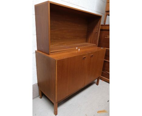 A mid 20th Century teak side cabinet with double doors; a teak two height wall hanging shelf unit.